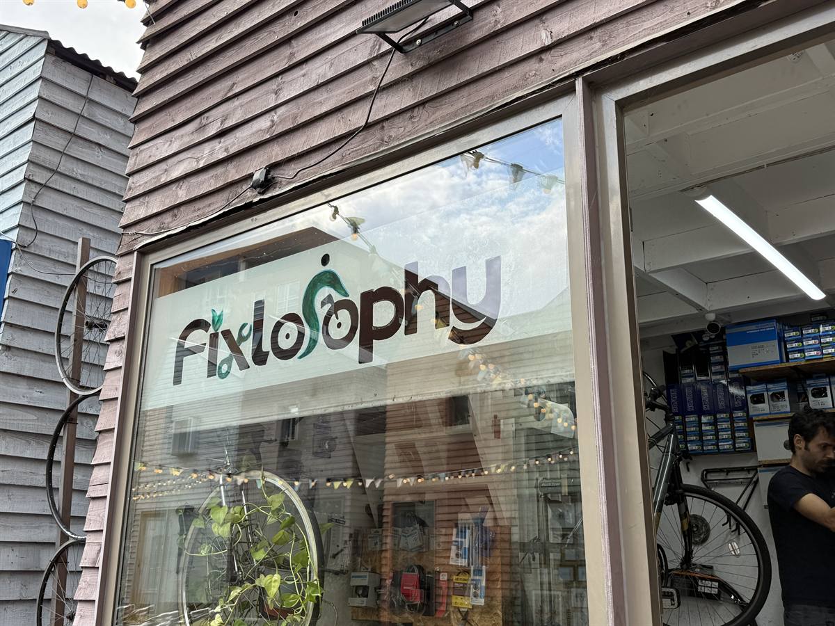 The Fixlosophy logo painted on the shop window