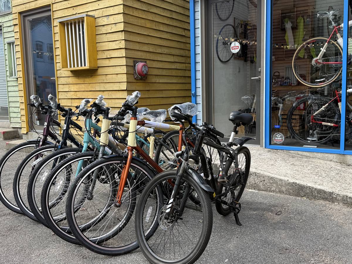A row of new bikes lined up outside the shop