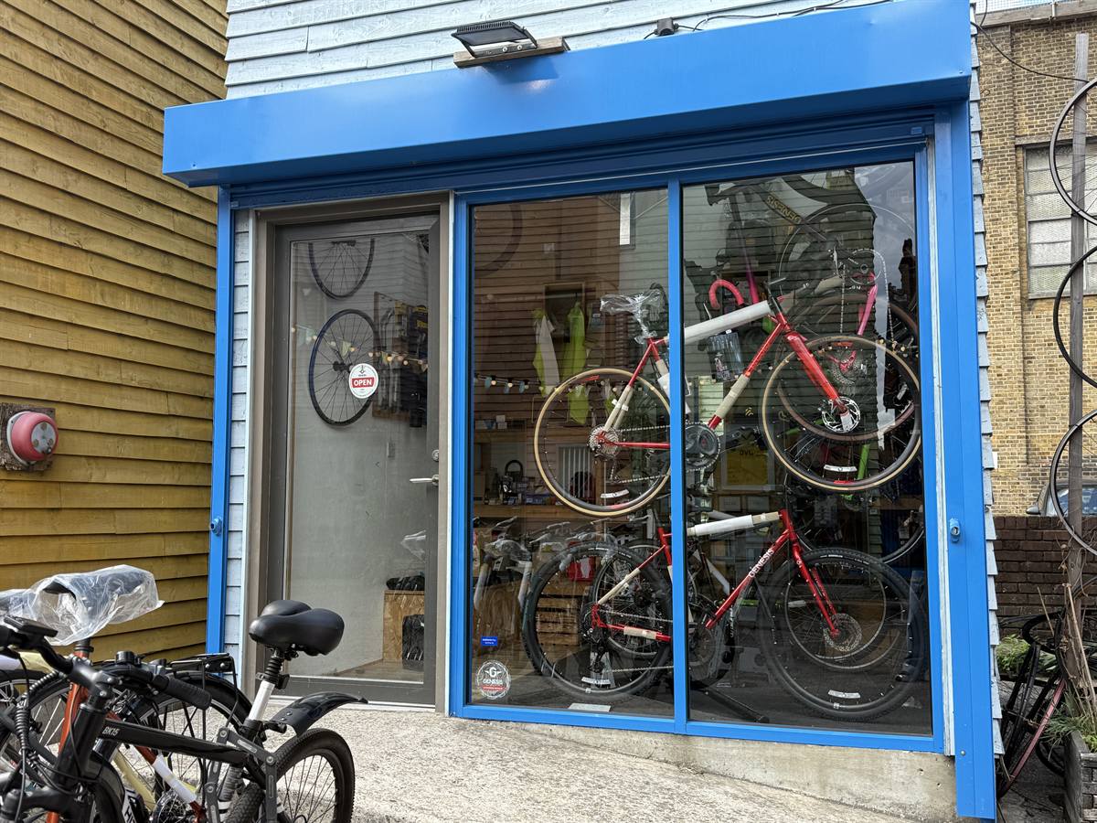 The blue shopfront with bikes displayed in the window