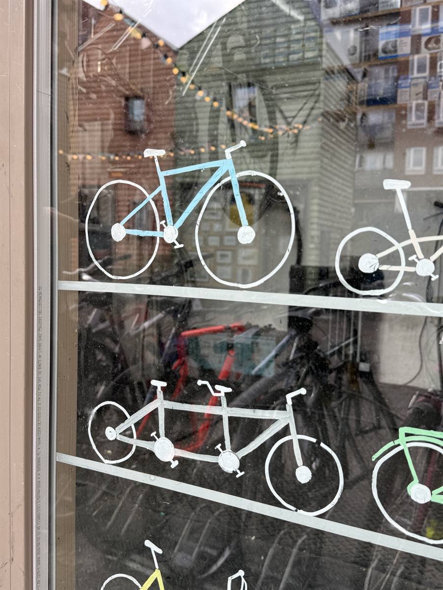 Close-up of the hand-painted bicycles on the window glass