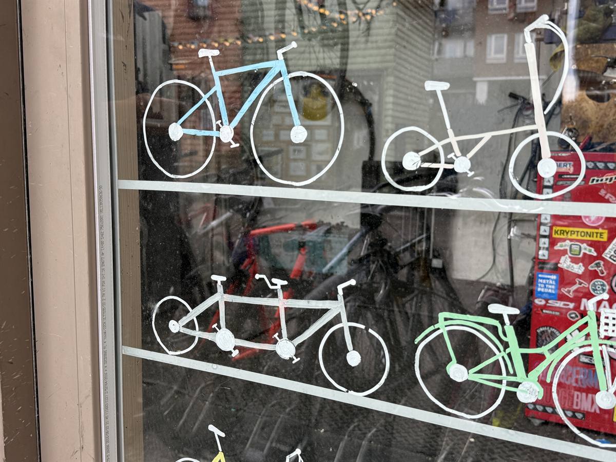 Bicycles hand-painted across the shop window
